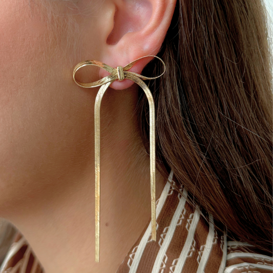 GOLD BOW STATEMENT EARRING- LONG