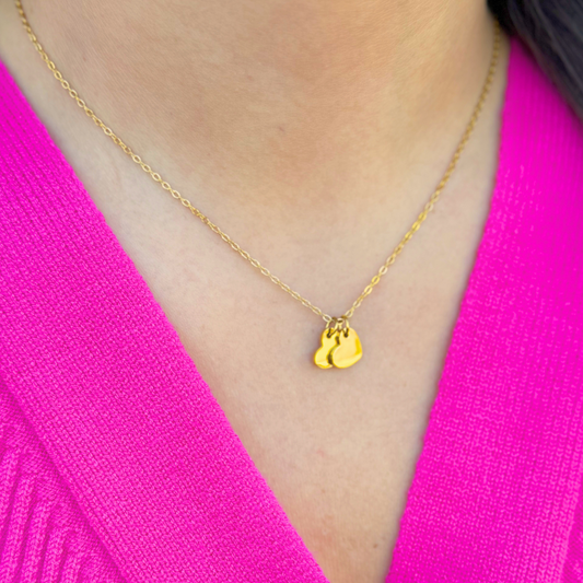 Gold necklace with two heart charms