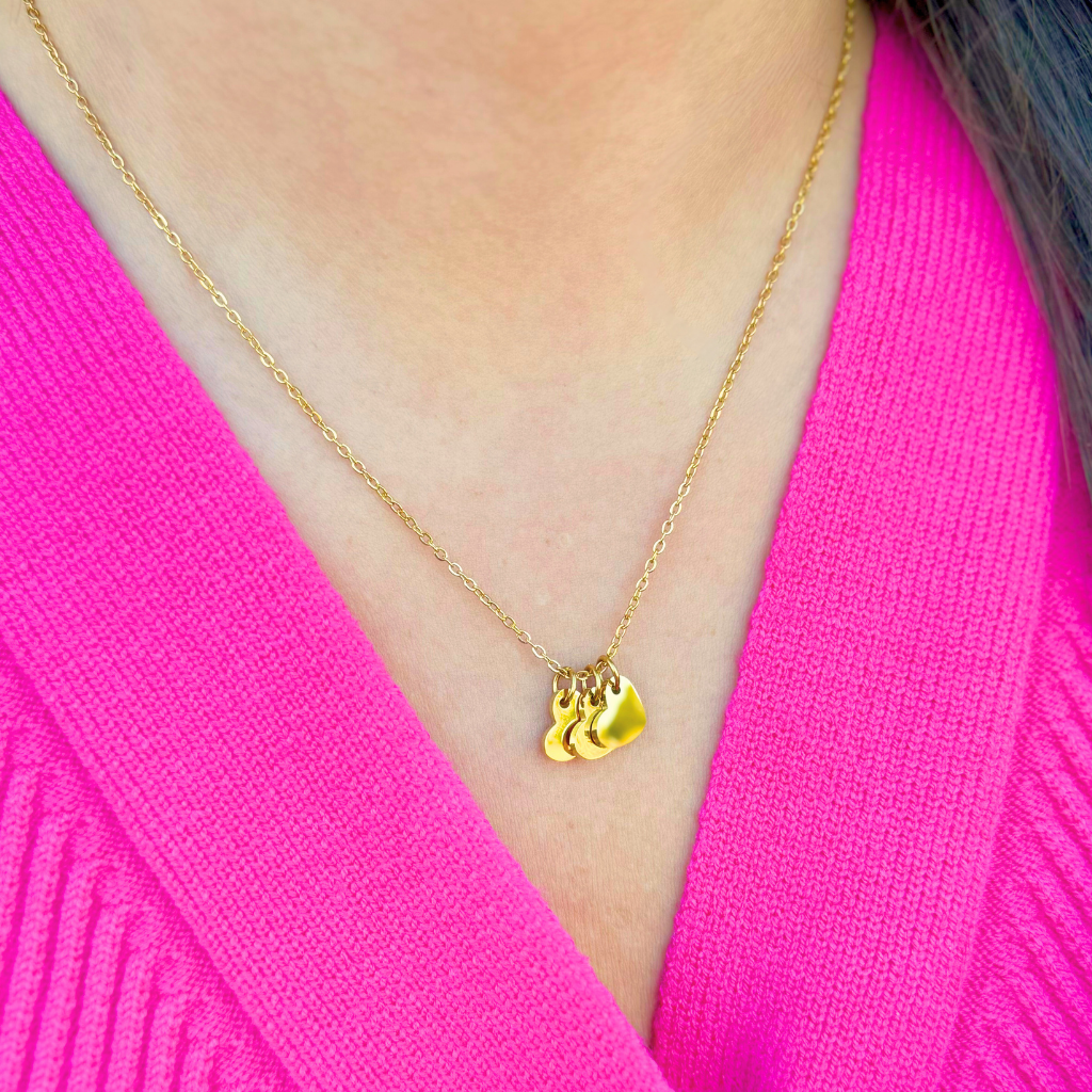 Gold necklace with three heart charms